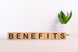 BENEFITS word made with building blocks on a light background
